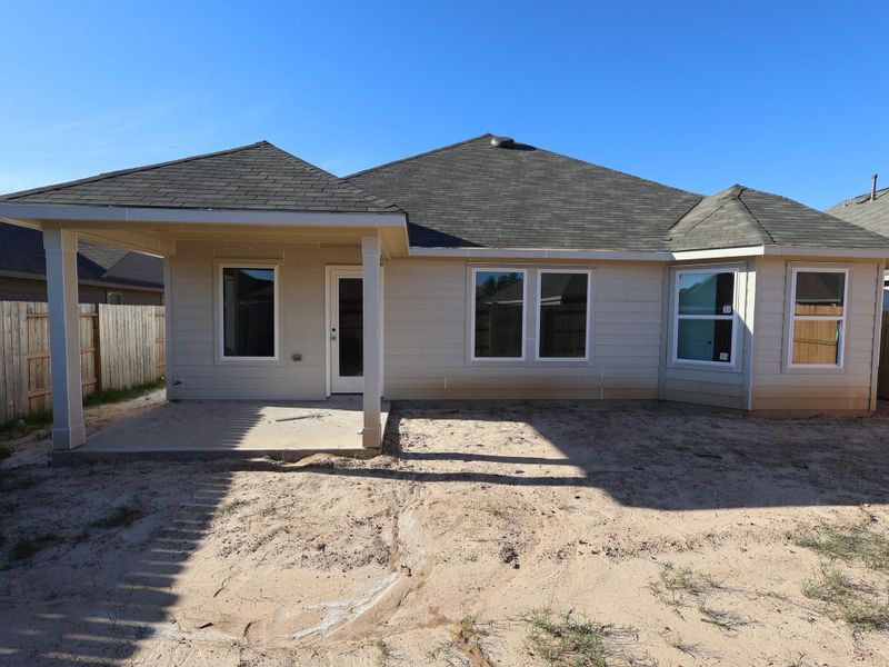 Exterior details and patio area of a home in Pinewood at Grand Texas, New Caney (Image 17).