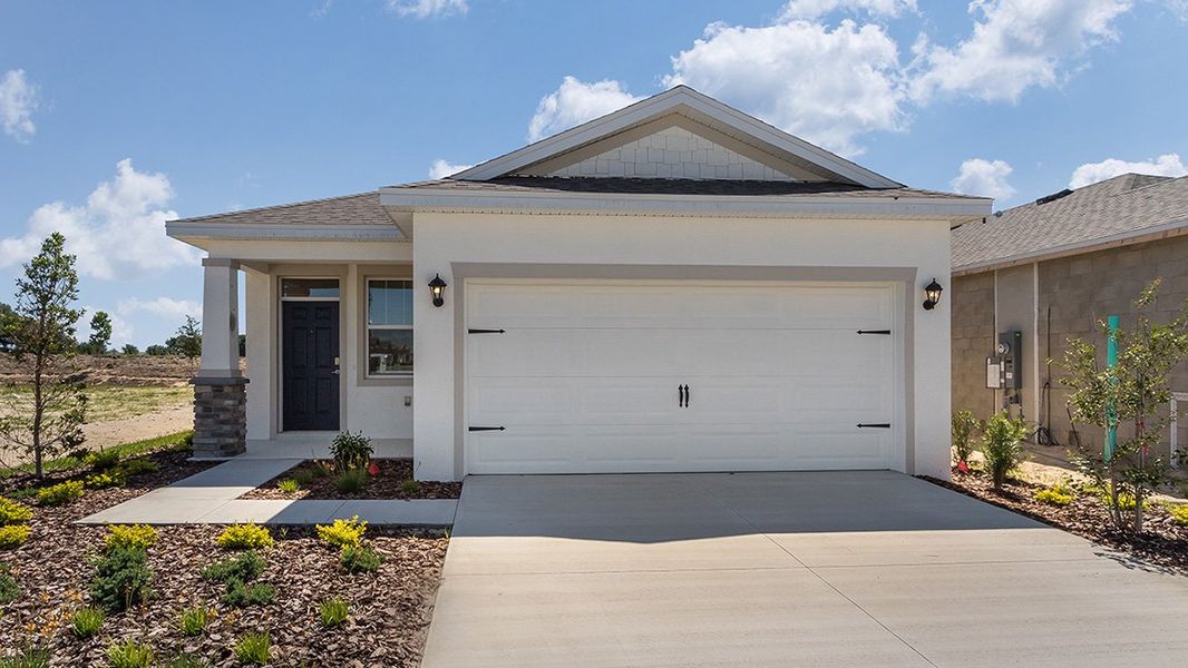 Representative exterior photo of a completed home built from the BOWEN by D.R. Horton in Twisted Oaks, Wildwood, FL (Image 1).