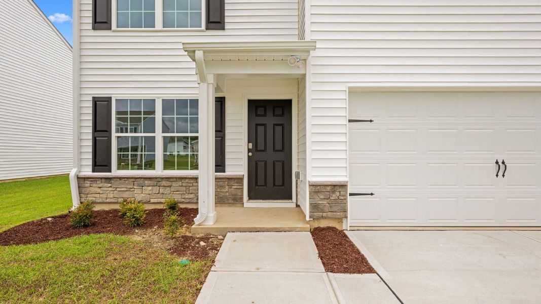 Front exterior of a new home in Madeline Farm, New Bern, NC, highlighting curb appeal (Image 14).
