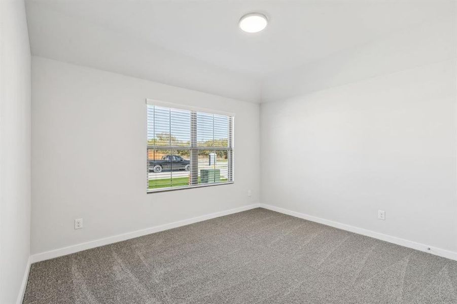 Bedroom in the Oscar home plan by Trophy Signature Homes – REPRESENTATIVE PHOTO