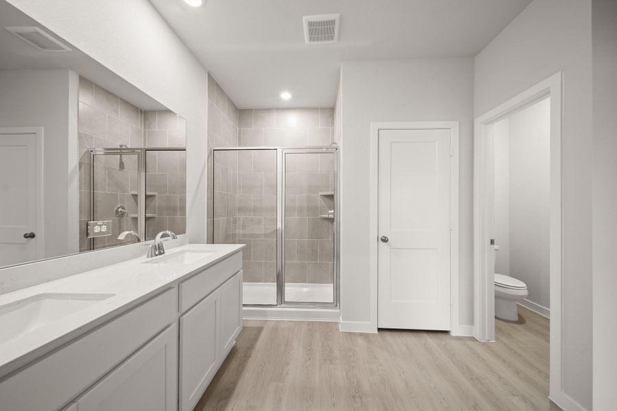 Furnished interior view inside a new home in Sunterra, Katy (Image 9).