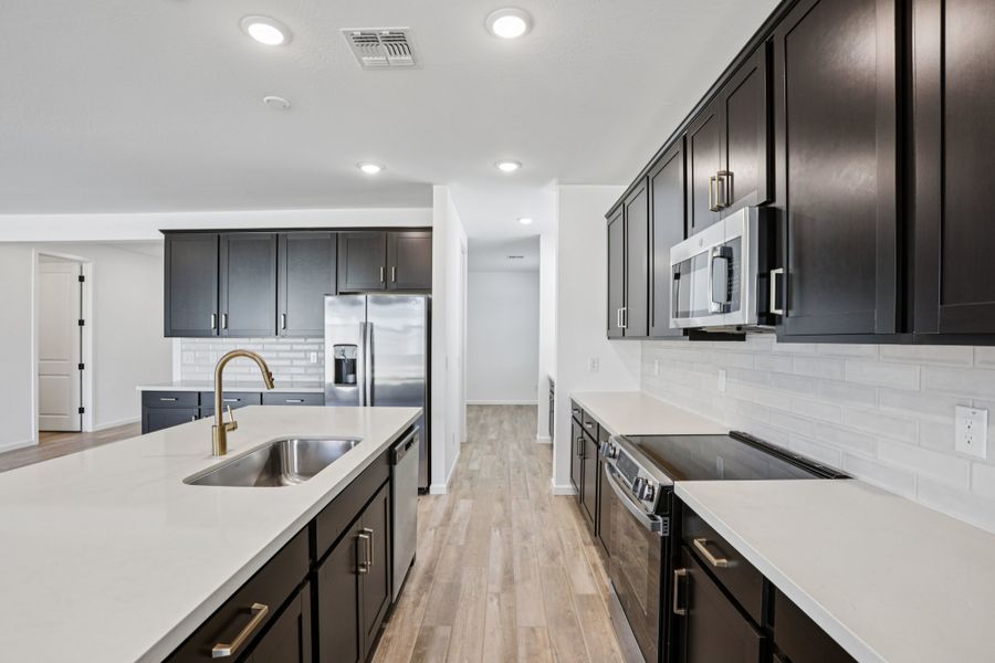 Kitchen - Sanctuary at Stonebridge Model Home. Finishes and options may vary by community