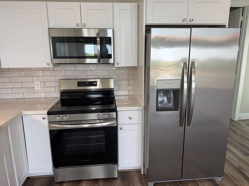 Stainless steel Electric stove and microwave.