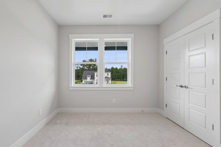 Spacious, unfurnished interior of a new home in Hidden Ponds Reserve, Awendaw (Image 46).