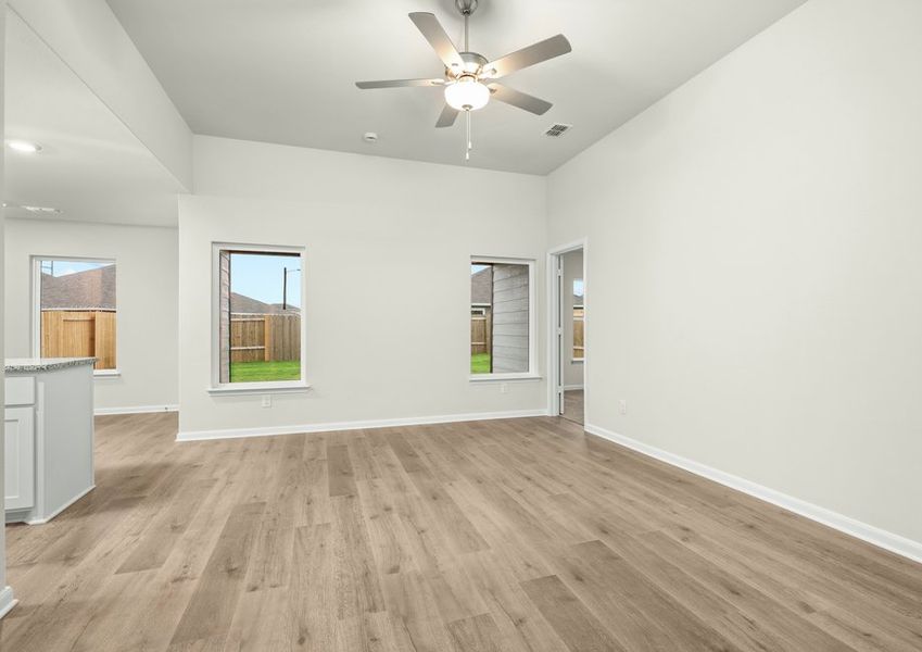 The family room has two large windows that let in great, natural light and backyard views. The family room has two large windows that let in great, natural light and backyard views.