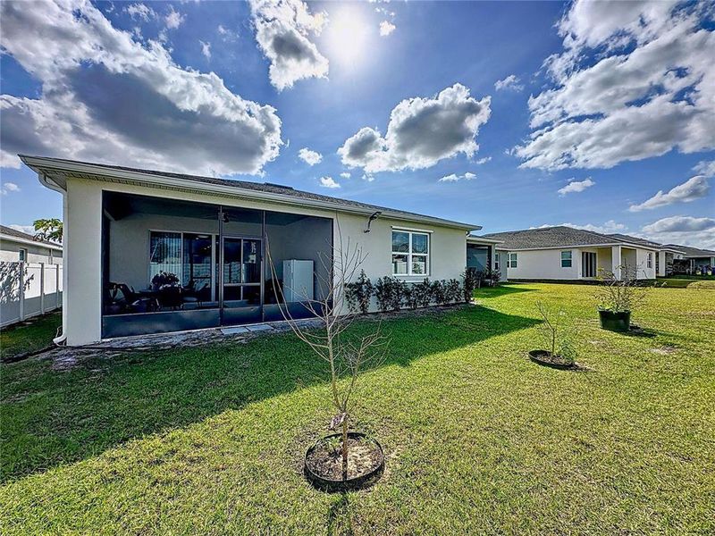 Front exterior of a new home in Seasons at Heritage Square, Haines City, FL, highlighting curb appeal (Image 26). Front exterior of a new home in Seasons at Heritage Square, Haines City, FL, highlighting curb appeal (Image 26).