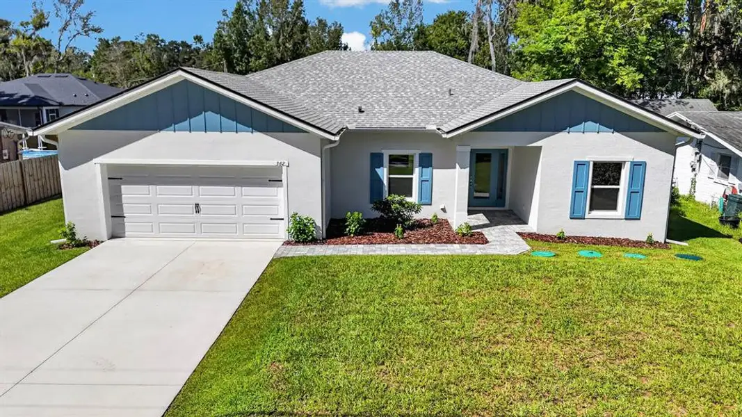 Front exterior of a new home in , New Smyrna Beach, FL, highlighting curb appeal (Image 19).