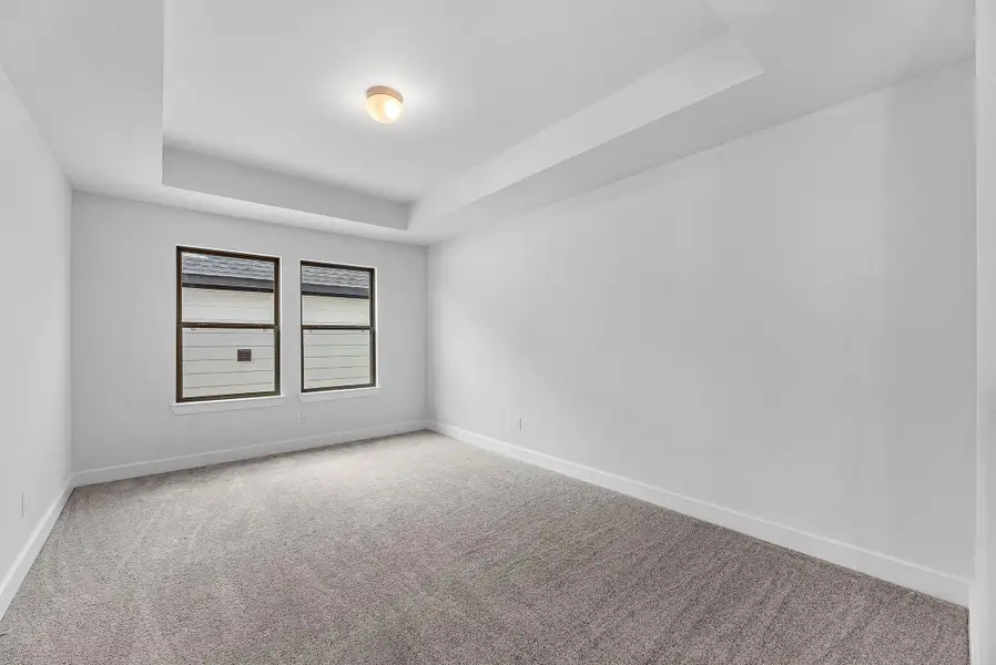 Spacious, unfurnished interior of a new home in Sunterra, Katy (Image 6).