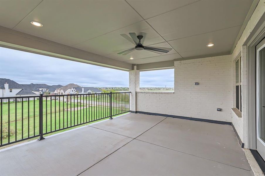 View of patio / terrace with a balcony and ceiling fan