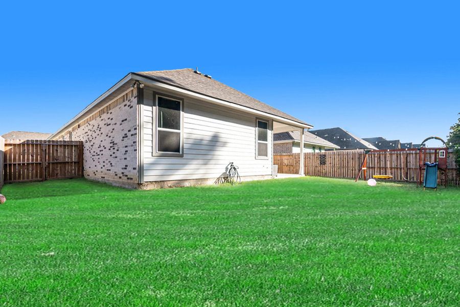 Exterior details and patio area of a home in , Anahuac (Image 26).