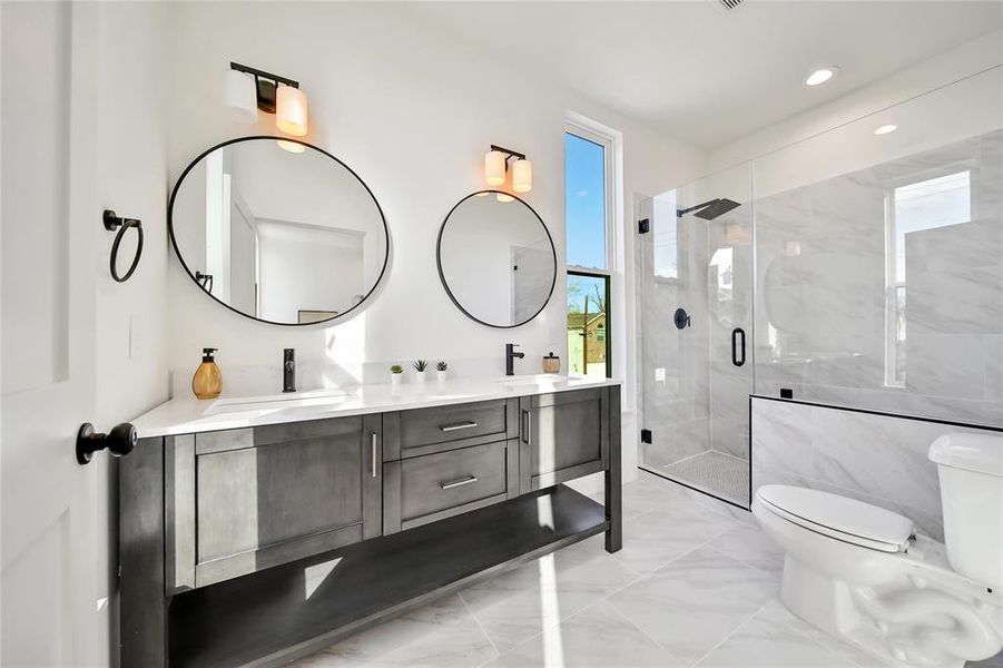 This photo was taken in another staged property with the same finishes and layout. Primary Bathroom.