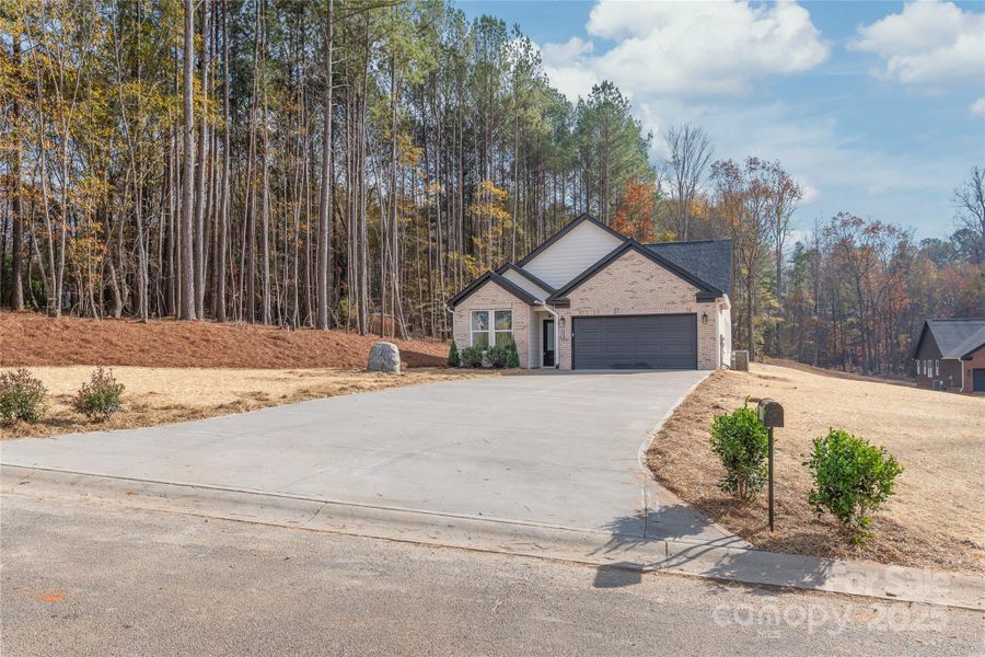 Front exterior of a new home in , Lincolnton, NC, highlighting curb appeal (Image 24).