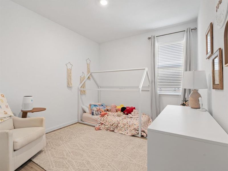 Bedroom featuring hardwood / wood-style flooring