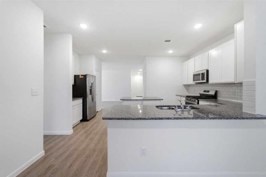 Furnished interior view inside a new home in The Canopies, Splendora (Image 9).