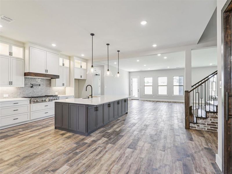 The well-appointed kitchen is a focal point of the home