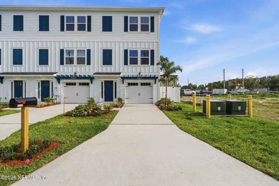 Front exterior of a new home in , Jacksonville Beach, FL, highlighting curb appeal (Image 22).
