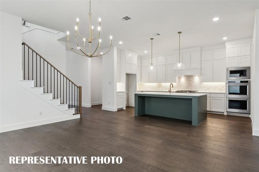 Open and flowing, our Prescott III plan was designed for entertaining.  REPRESENTATIVE PHOTO