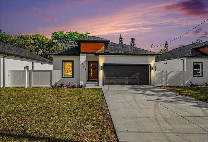 Front exterior of a new home in , Tampa, FL, highlighting curb appeal (Image 1). Front exterior of a new home in , Tampa, FL, highlighting curb appeal (Image 1).