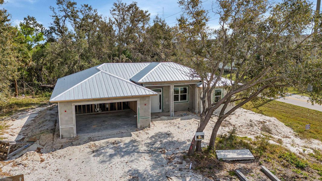 Front exterior of a new home in , Port Charlotte, FL, highlighting curb appeal (Image 1). Front exterior of a new home in , Port Charlotte, FL, highlighting curb appeal (Image 1).