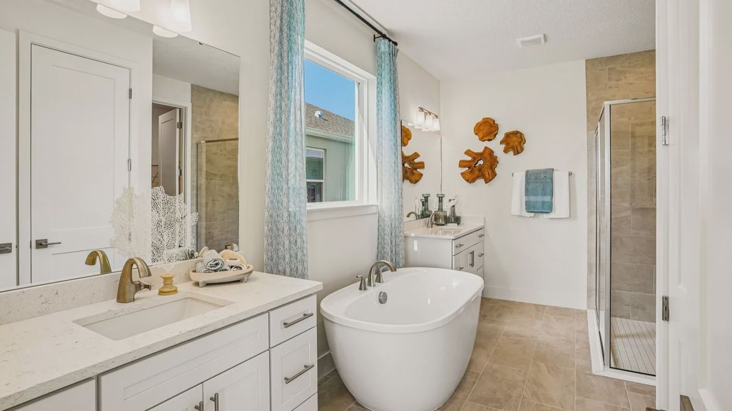 Oleander Primary Suite En Suite Bath by DRB Homes in Ardisia Park in New Smyrna Beach, FL