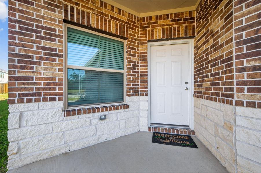 Exterior details and patio area of a home in Woodland Lakes, Huffman (Image 26).