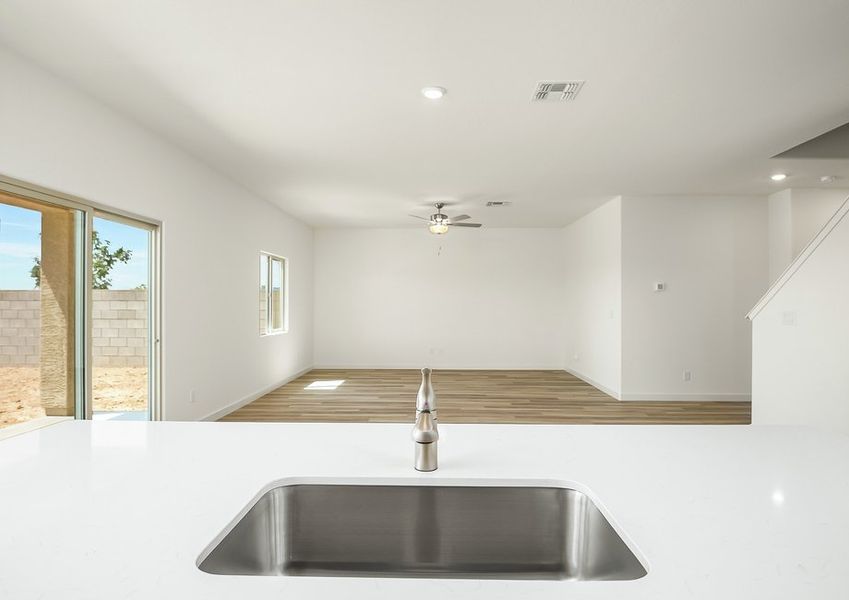 Kitchen island with undermount sink and quartz countertops in Wellton floor plan