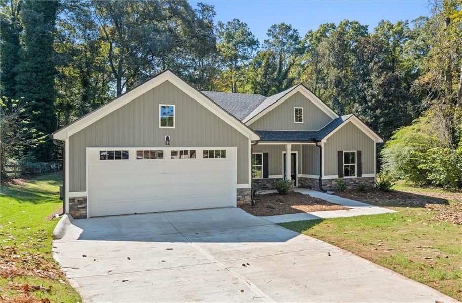 Front exterior of a new home in , Carrollton, GA, highlighting curb appeal (Image 24).