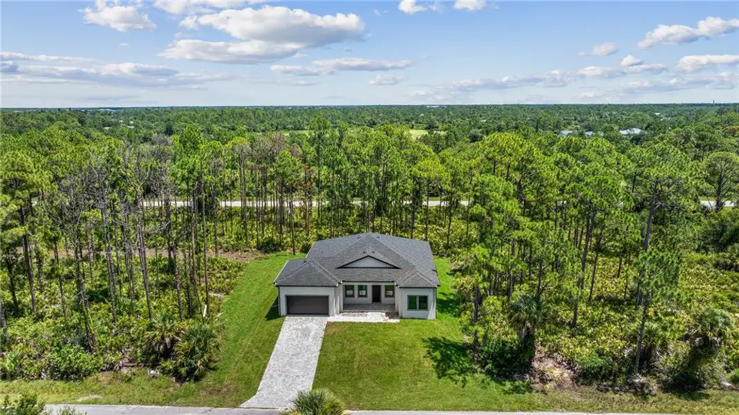 Front exterior of a new home in , Port Charlotte, FL, highlighting curb appeal (Image 1). Front exterior of a new home in , Port Charlotte, FL, highlighting curb appeal (Image 1).