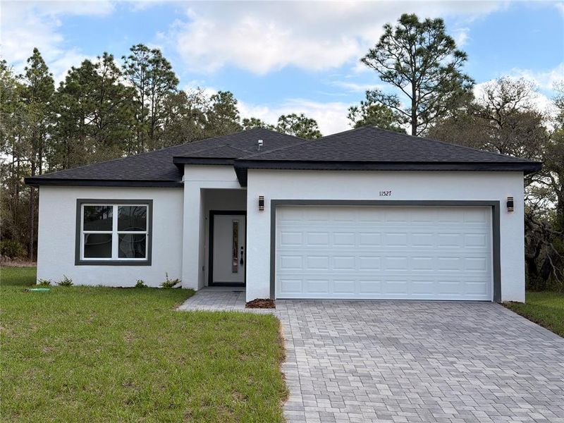 Front exterior of a new home in , Dunnellon, FL, highlighting curb appeal (Image 2). Front exterior of a new home in , Dunnellon, FL, highlighting curb appeal (Image 2).
