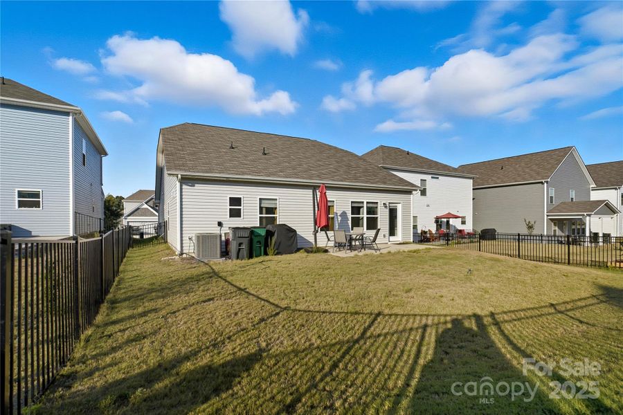 Exterior details and patio area of a home in Orchard Creek, Charlotte (Image 21).
