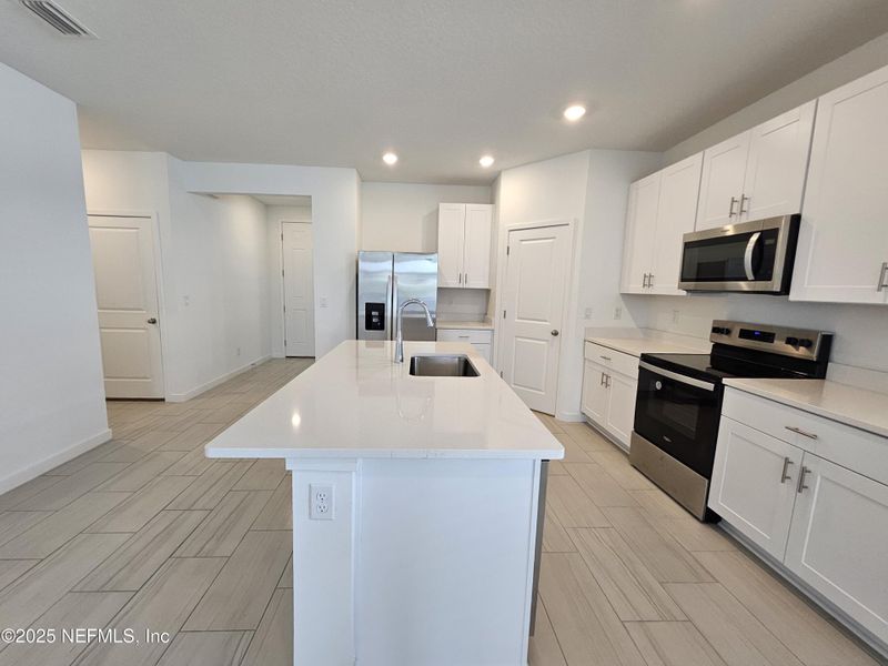 Furnished interior view inside a new home in Lakes at Bella Lago - Signature Series, Green Cove Springs (Image 12).