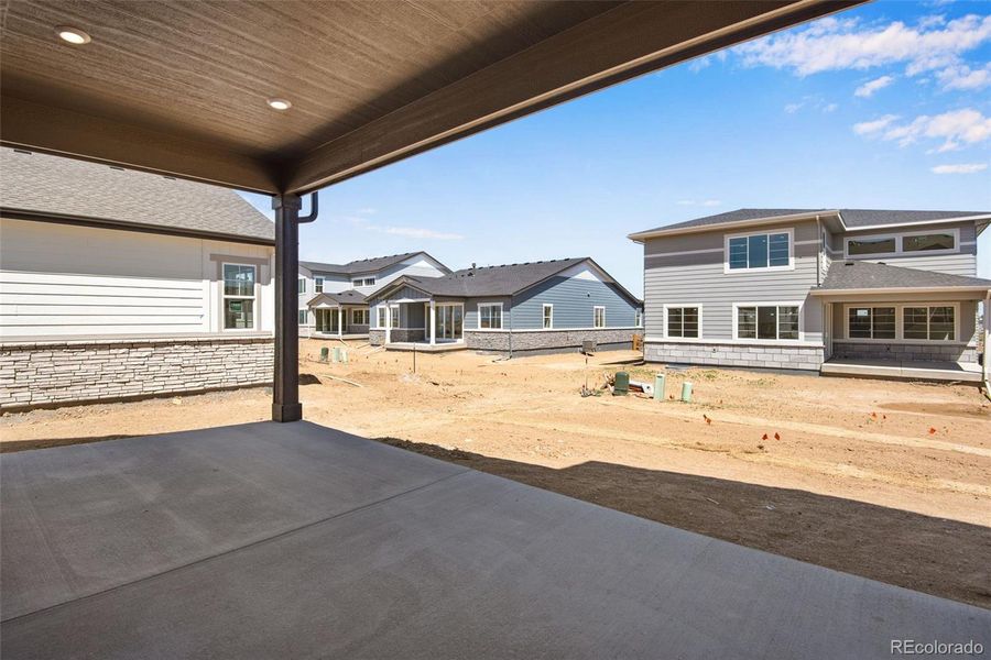 Front exterior of a new home in Prelude at The Aurora Highlands, Aurora, CO, highlighting curb appeal (Image 1).