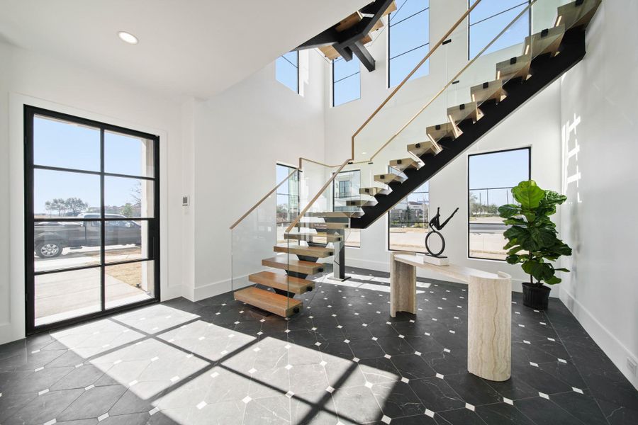 Another look at the entrance. Modern steel and glass front door.