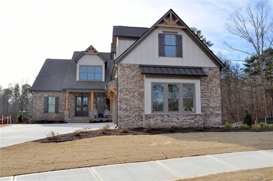 Front exterior of a new home in Woodford, Acworth, GA, highlighting curb appeal (Image 26).