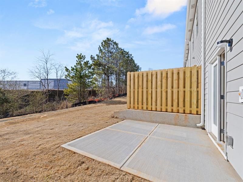 Front exterior of a new home in Waypoint, Flowery Branch, GA, highlighting curb appeal (Image 16).