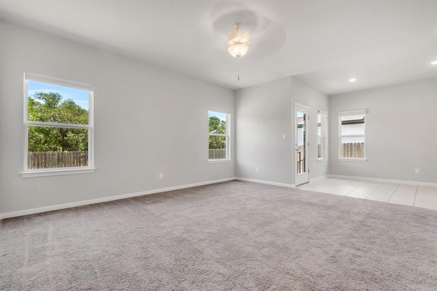A spacious living area with ample natural light offers comfort and versatility.