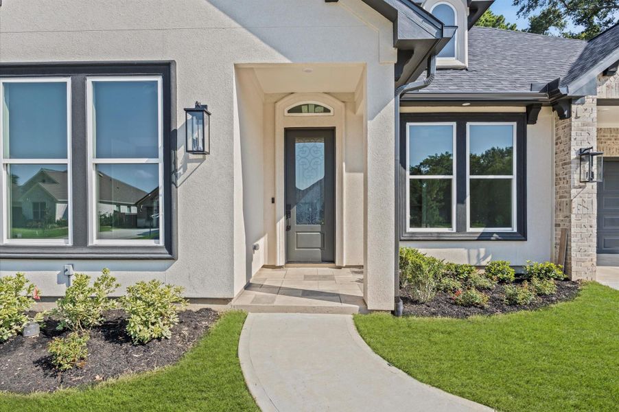 Front exterior of a new home in , Montgomery, TX, highlighting curb appeal (Image 24). Front exterior of a new home in , Montgomery, TX, highlighting curb appeal (Image 24).