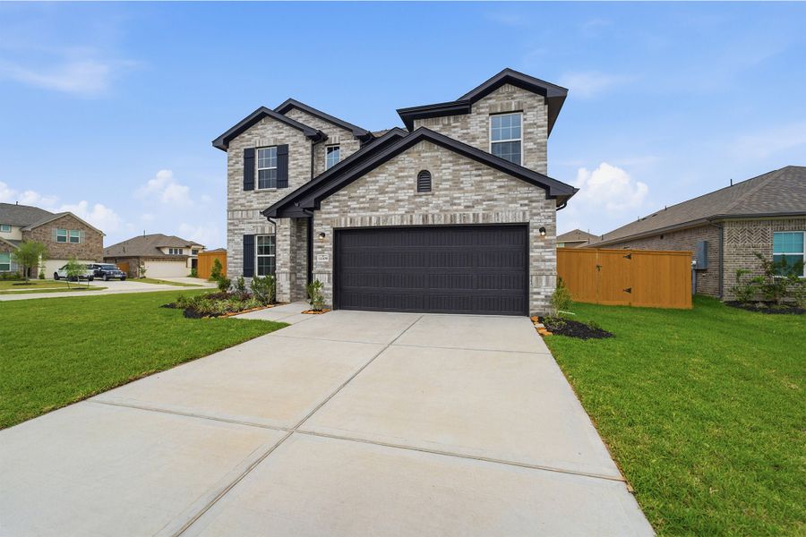 Front exterior of a new home in Lago Mar, Texas City, TX, highlighting curb appeal (Image 25).