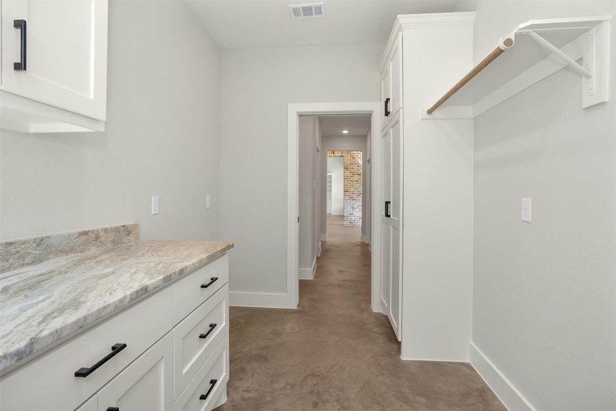 Whether handling daily laundry or extra storage needs, this spacious utility room delivers convenience and organization without sacrificing style.