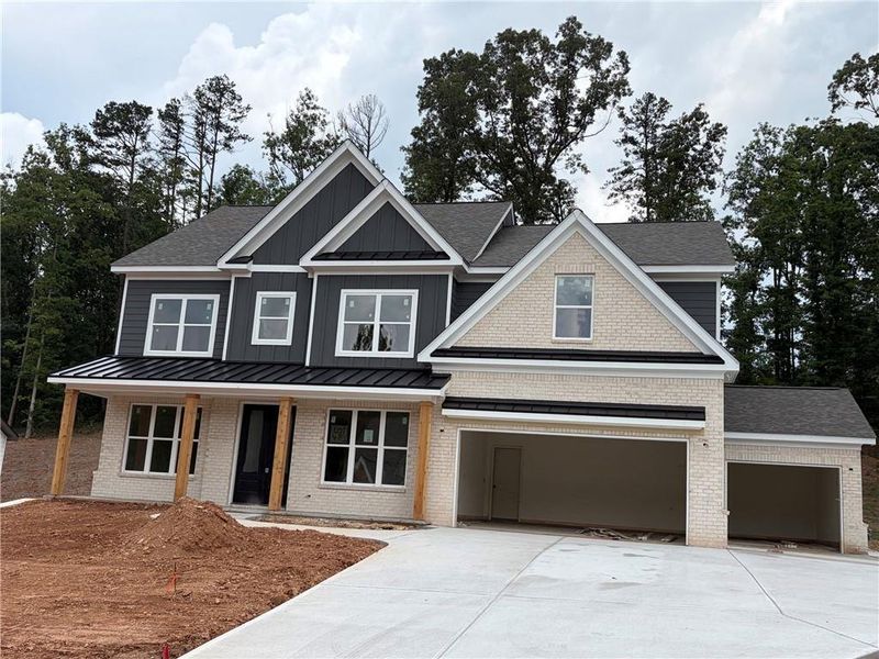 Front exterior of a new home in , Cumming, GA, highlighting curb appeal (Image 2). Front exterior of a new home in , Cumming, GA, highlighting curb appeal (Image 2).