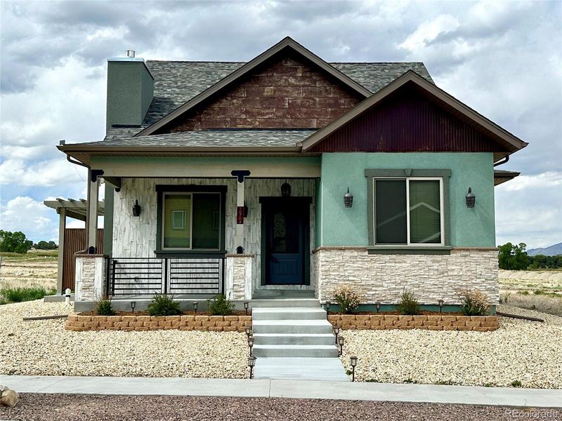 Front exterior of a new home in , Poncha Springs, CO, highlighting curb appeal (Image 20).