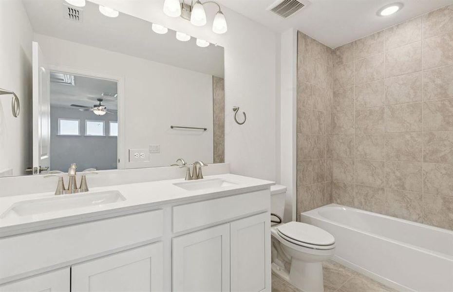 Upgraded secondary bath with elegant finishes