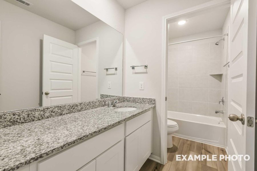 Furnished interior view inside a new home in Caney Creek Place, Conroe (Image 12).