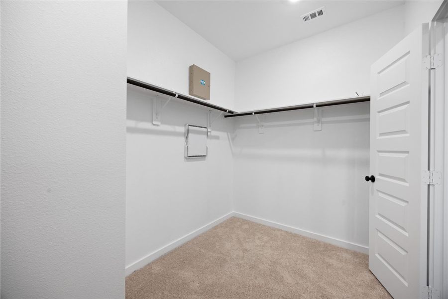 Large walk in primary closet Large walk in primary closet