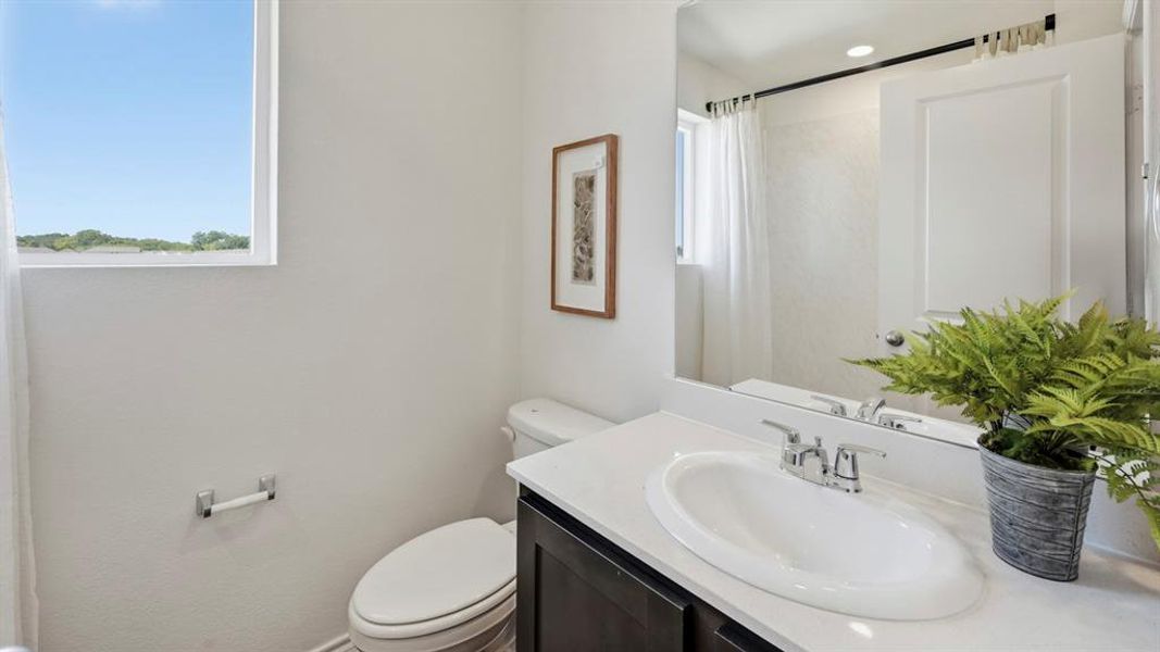 Full bathroom featuring vanity and a shower with curtain