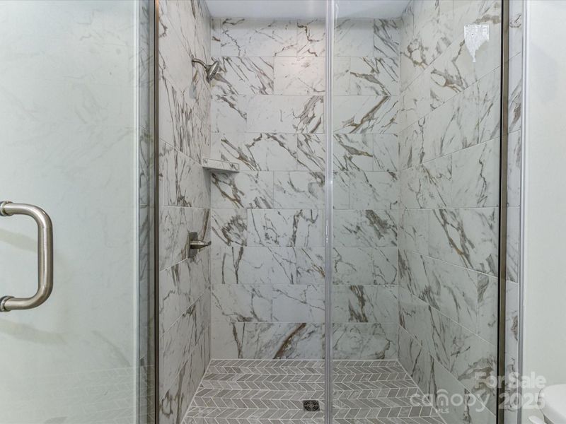 Modern Tiled Walk-In Shower at Primary Bath.