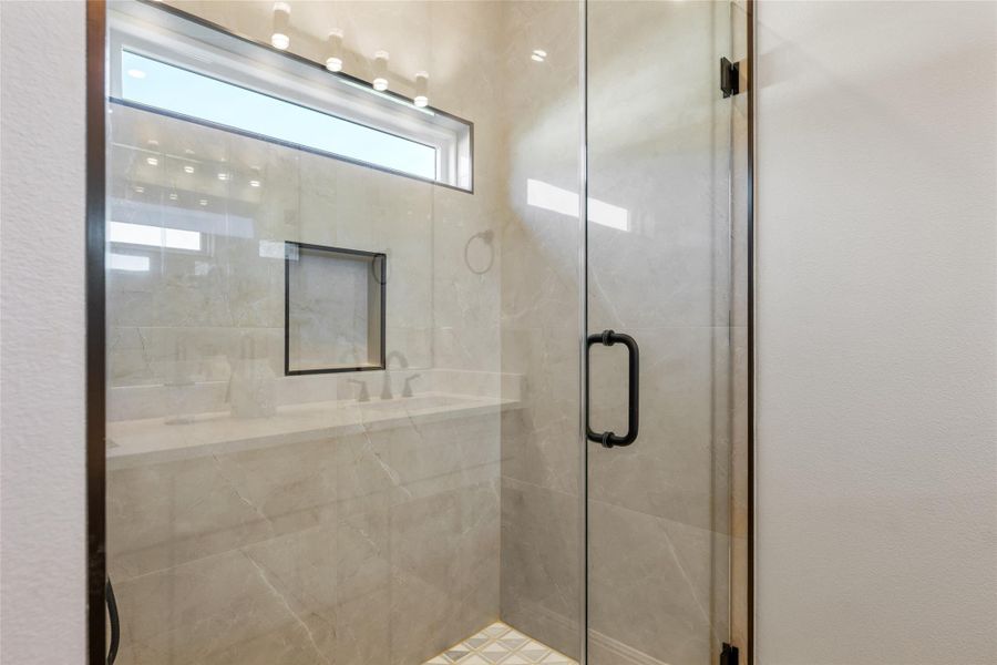 Full bathroom with a shower stall