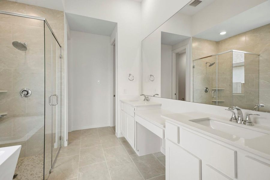 Primary Bathroom with vanity area next to the sink. Primary Bathroom with vanity area next to the sink.