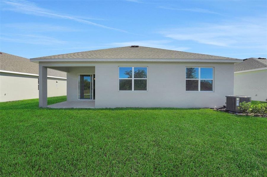 Exterior details and patio area of a home in Willowbrook North, Winter Haven (Image 16).
