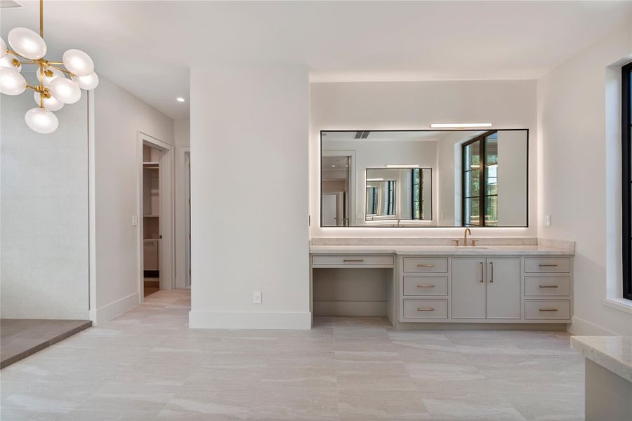 Enormous size bath with rain head shower, separate shower heads/wands, and separate soaking tub that’s located under a window to gaze out as you relax.  NOTE: This photo is a rendering of one of the builder’s prior homes and similarly used as an example for this home. Please contact the listing agent to tour this property and for more detailed information.